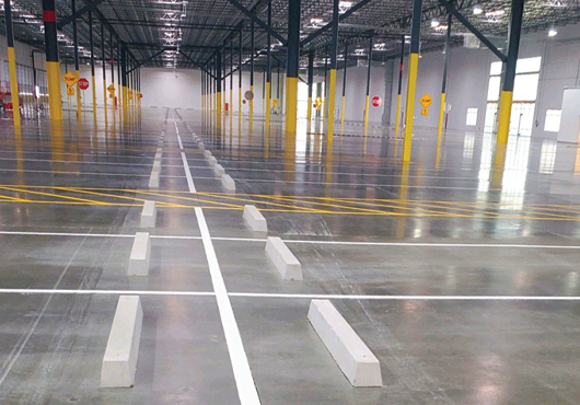 Once construction was complete, Hitt Concrete & Site Construction, Inc. crews completed the striping and wheel stops at this interior distribution center.